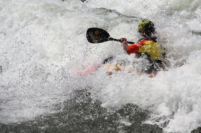 kayaker in a rapid