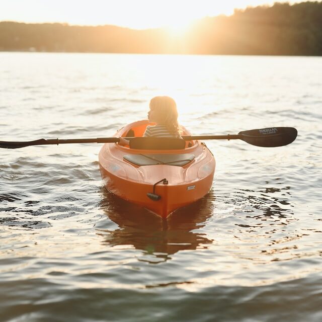 young kid in a kayak