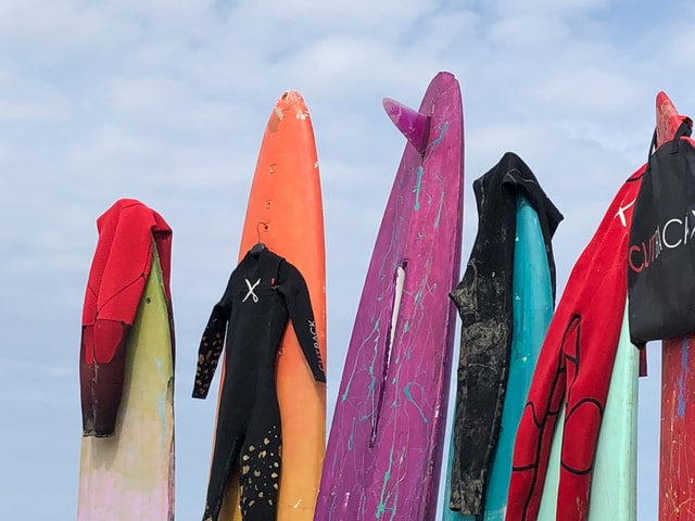 wetsuits on surfboards