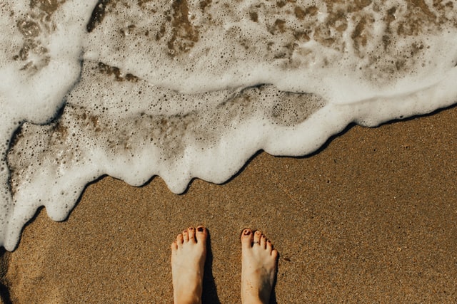 feet near waves